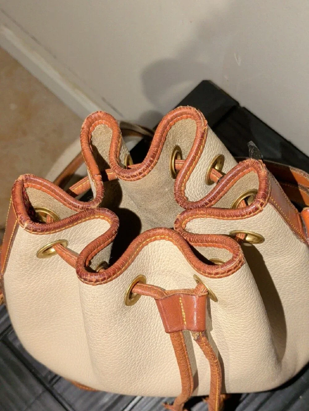 Dooney & Bourke Cream and Brown Drawstring Bucket Bag